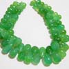 This listing is for the 63 Pieces of Chrysoprase Green Chalcedony smooth Drops briolettes in size of 5x8 - 7x12 mm approx,,Length: 8 inch,,Total Pcs: 63